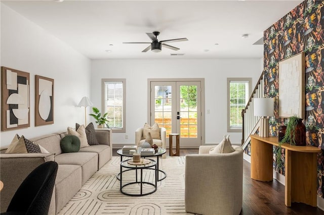1196 Wylie St SE, Atlanta, GA 30316 - living room featuring dark wood-style floors, a ceiling fan, french doors, stairs, and baseboards