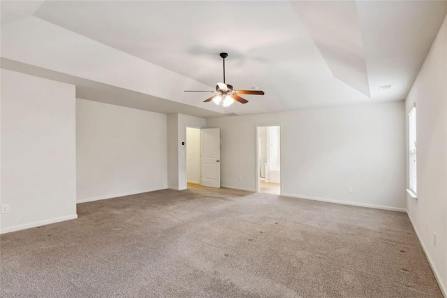 spare room featuring carpet and ceiling fan