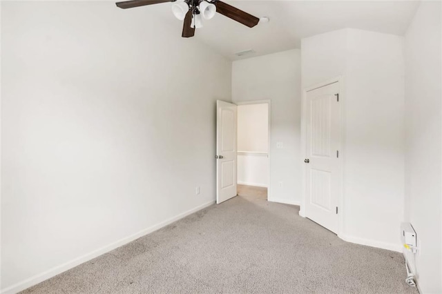 unfurnished bedroom with ceiling fan and light colored carpet