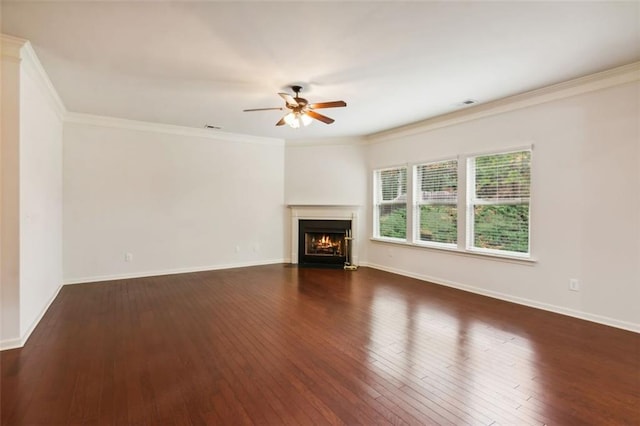 unfurnished living room with dark hardwood / wood-style floors, ceiling fan, and ornamental molding