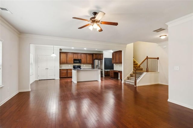 unfurnished living room with dark hardwood / wood-style floors, ceiling fan, and crown molding