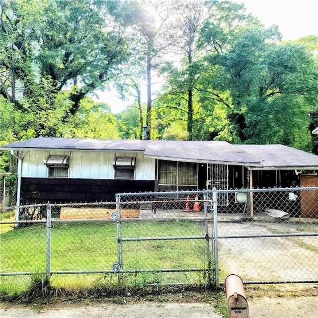 ranch-style house with a front lawn