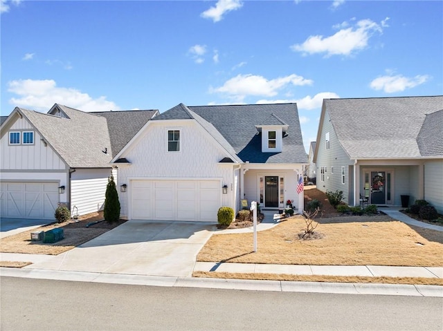 modern farmhouse style home featuring concrete driveway, an attached garage, board and batten siding, and a shingled roof