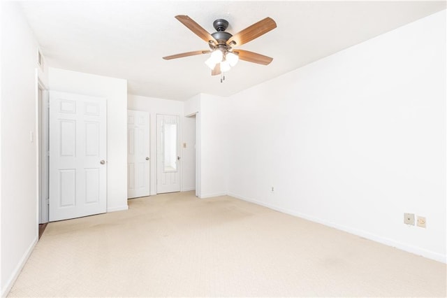 2901 Lenox Way NE Unit 902, Atlanta, GA 30324 - unfurnished bedroom featuring light colored carpet, baseboards, and a ceiling fan