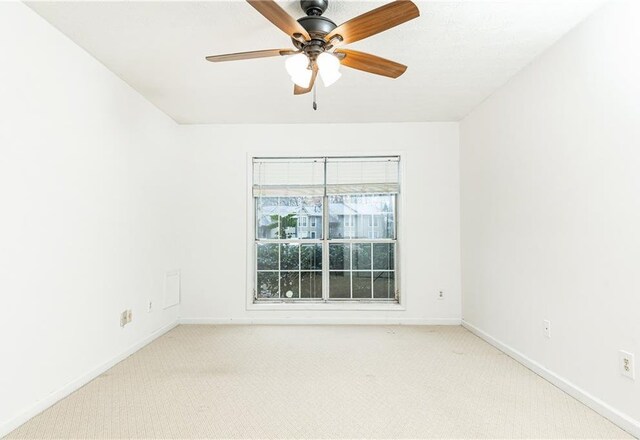 2901 Lenox Way NE Unit 902, Atlanta, GA 30324 - empty room featuring light carpet, ceiling fan, and baseboards