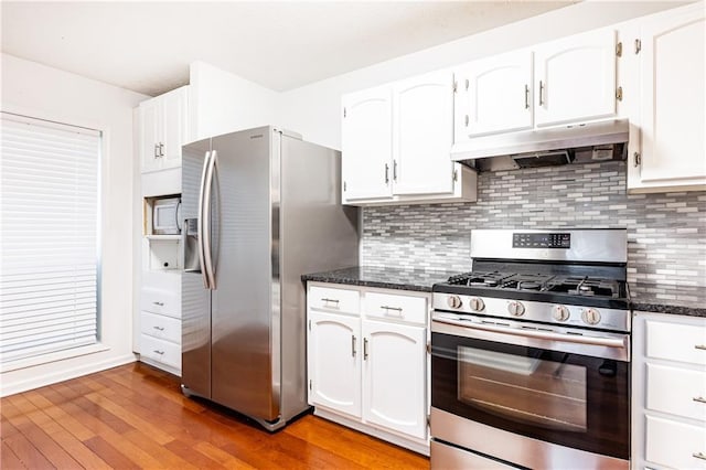 2901 Lenox Way NE Unit 902, Atlanta, GA 30324 - kitchen featuring stainless steel appliances, under cabinet range hood, light wood finished floors, and white cabinetry