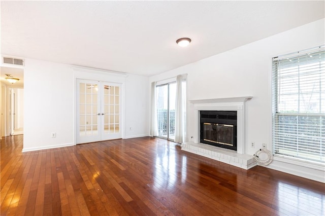 2901 Lenox Way NE Unit 902, Atlanta, GA 30324 - unfurnished living room with hardwood / wood-style flooring, baseboards, french doors, and a brick fireplace