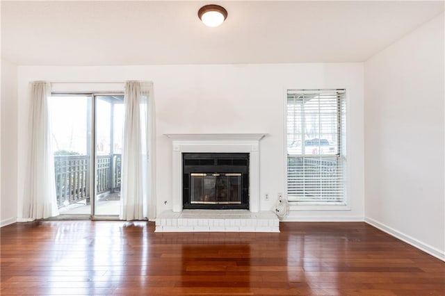 2901 Lenox Way NE Unit 902, Atlanta, GA 30324 - unfurnished living room featuring hardwood / wood-style floors, plenty of natural light, and a fireplace