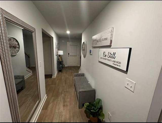 corridor featuring dark hardwood / wood-style floors