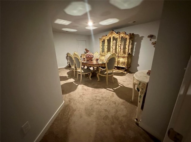 view of carpeted dining area