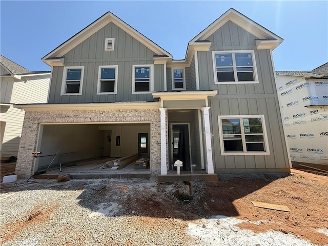 craftsman-style house featuring a garage and board and batten siding