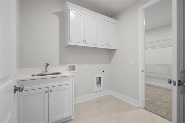 washroom with sink, cabinets, washer hookup, electric dryer hookup, and light colored carpet