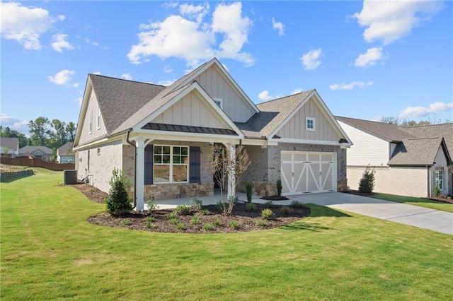 view of front facade with central AC, a porch, a front yard, and a garage