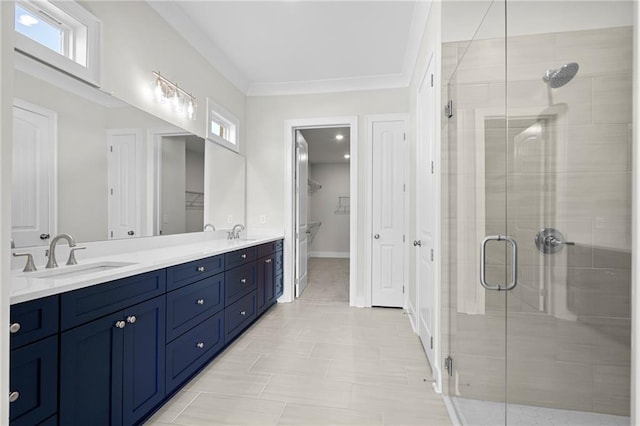 bathroom featuring crown molding, vanity, and a shower with shower door