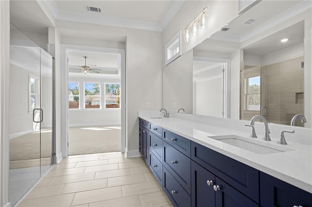 bathroom with tile patterned floors, an enclosed shower, ornamental molding, vanity, and ceiling fan