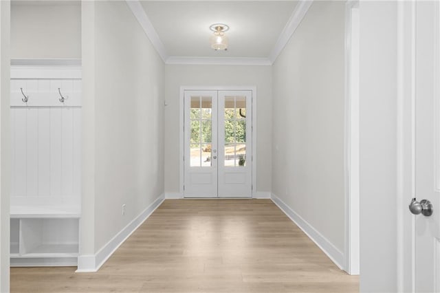 doorway to outside with french doors, light hardwood / wood-style floors, and crown molding