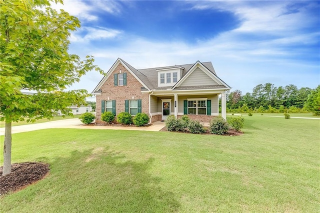 craftsman-style house featuring a front yard and covered porch