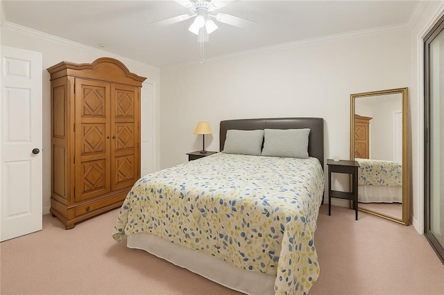 bedroom with crown molding, ceiling fan, and light colored carpet