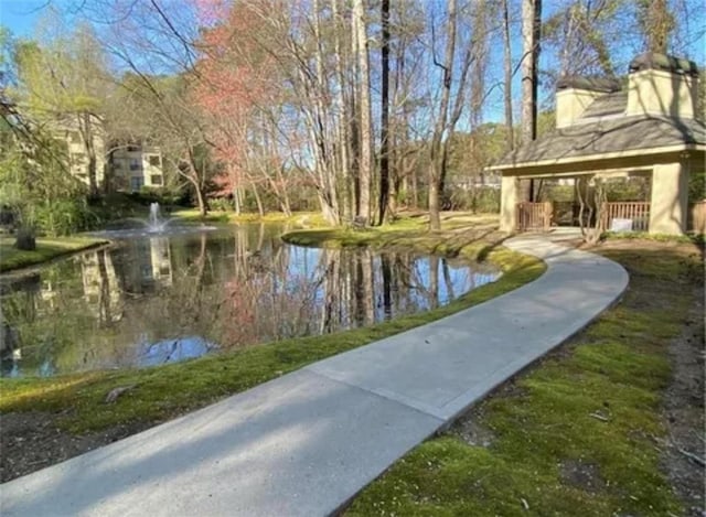 surrounding community featuring a water view