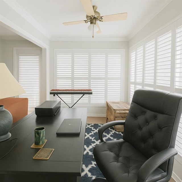 office area featuring crown molding, ceiling fan, and a healthy amount of sunlight
