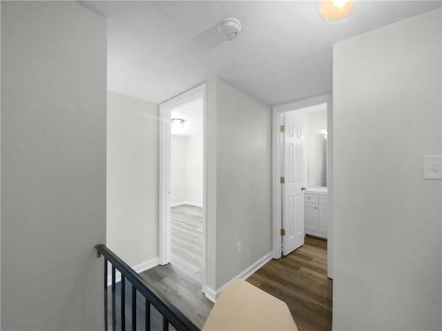 hallway featuring dark hardwood / wood-style flooring