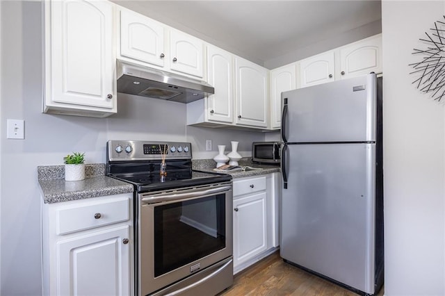 kitchen with appliances with stainless steel finishes, dark hardwood / wood-style floors, and white cabinets