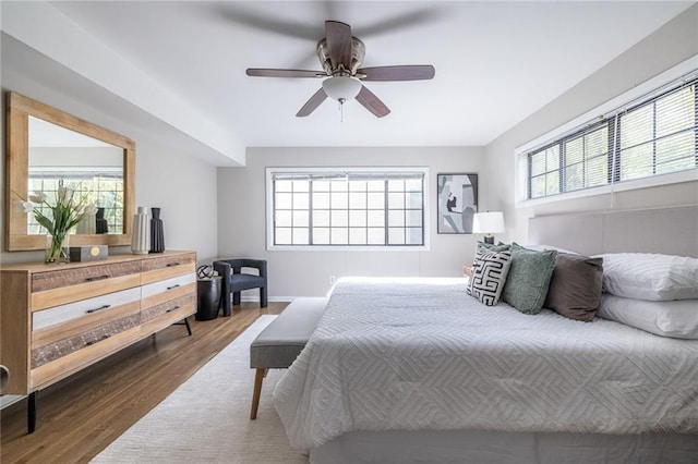 bedroom featuring dark wood-type flooring and ceiling fan