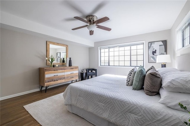 bedroom featuring dark hardwood / wood-style floors and ceiling fan