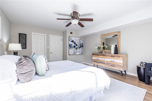 bedroom with hardwood / wood-style flooring and ceiling fan