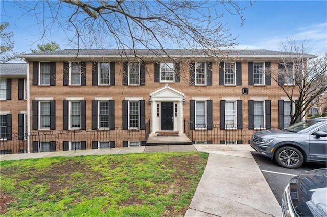 view of front of house featuring brick siding