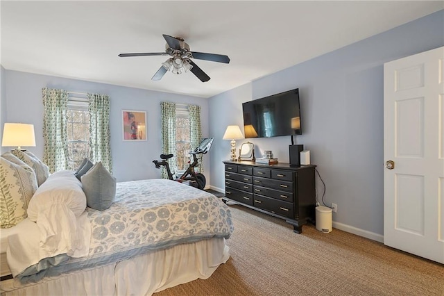 bedroom with ceiling fan, carpet floors, and baseboards