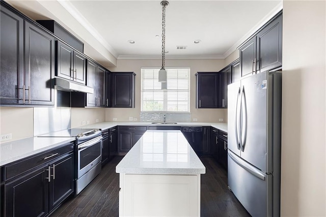 164 Blakemore Dr, Smyrna, GA 30080 - kitchen featuring stainless steel appliances, under cabinet range hood, a center island, crown molding, and dark wood finished floors