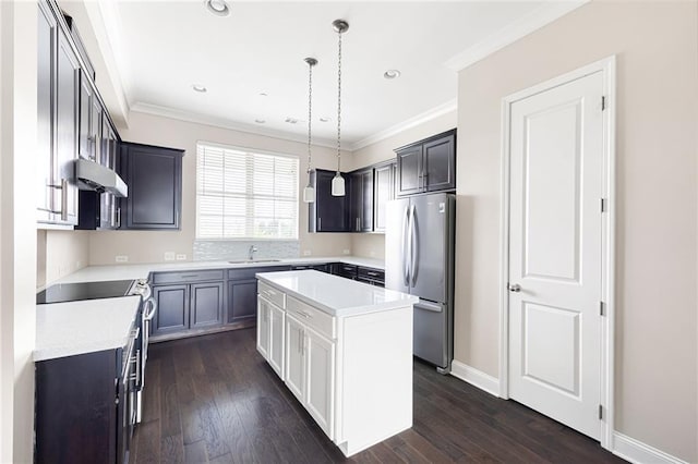 164 Blakemore Dr, Smyrna, GA 30080 - kitchen with freestanding refrigerator, under cabinet range hood, stove, a kitchen island, and light countertops