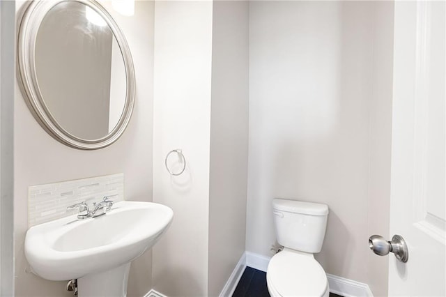 164 Blakemore Dr, Smyrna, GA 30080 - half bathroom with toilet and tasteful backsplash