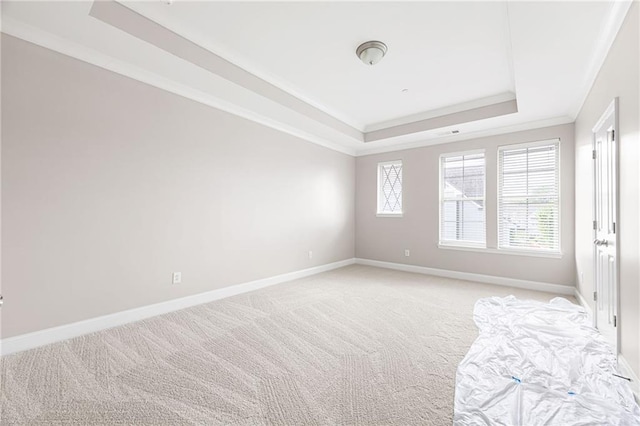164 Blakemore Dr, Smyrna, GA 30080 - unfurnished bedroom featuring a tray ceiling, light colored carpet, and ornamental molding