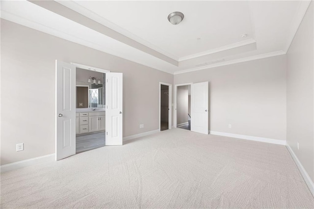 164 Blakemore Dr, Smyrna, GA 30080 - unfurnished bedroom with a tray ceiling, crown molding, light carpet, and connected bathroom