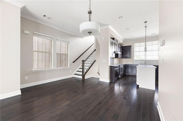 164 Blakemore Dr, Smyrna, GA 30080 - unfurnished living room with dark wood finished floors, crown molding, stairway, and recessed lighting