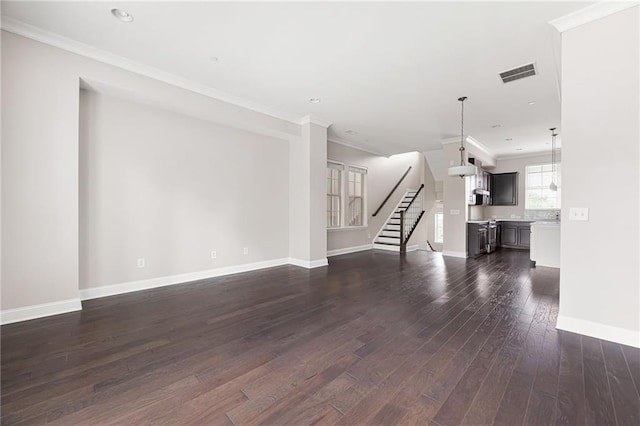 164 Blakemore Dr, Smyrna, GA 30080 - unfurnished living room with dark wood finished floors, ornamental molding, stairs, and recessed lighting
