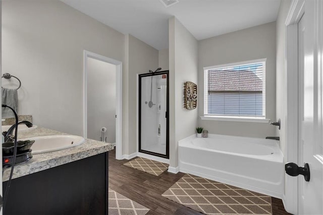 7 Wilmer Way, Cartersville, GA 30120 - full bathroom with a garden tub, a stall shower, double vanity, and wood finished floors