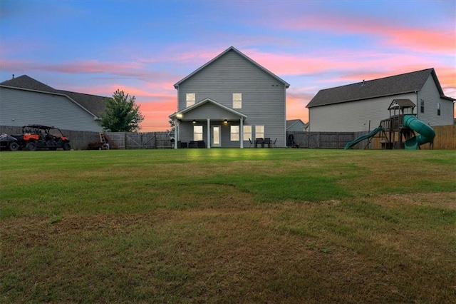 7 Wilmer Way, Cartersville, GA 30120 - back of property at dusk with a playground and a fenced backyard