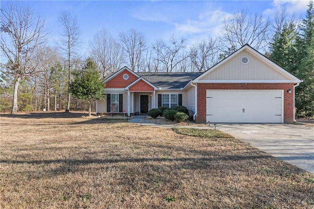 view of front of property with concrete driveway, a front lawn, an attached garage, and brick siding