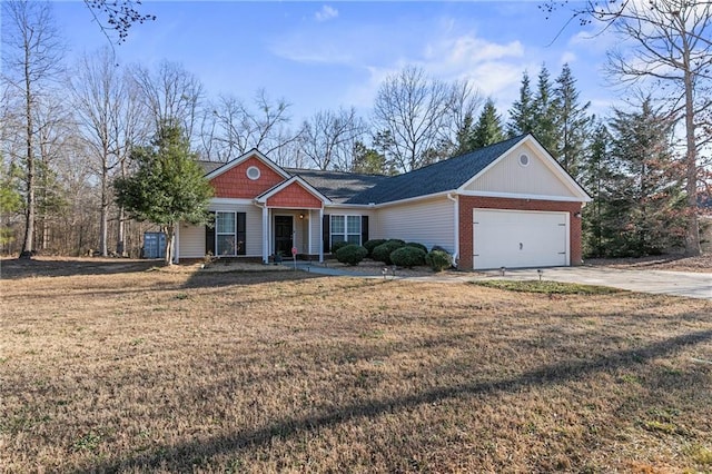 view of front of house with an attached garage, a front lawn, concrete driveway, and brick siding