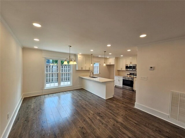 5 George Wythe Pl NW, Atlanta, GA 30318 - kitchen with pendant lighting, white cabinetry, appliances with stainless steel finishes, and sink