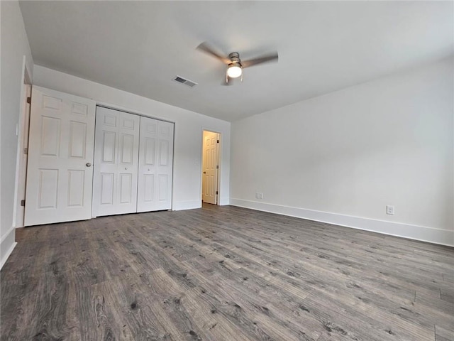 5 George Wythe Pl NW, Atlanta, GA 30318 - unfurnished bedroom with hardwood / wood-style flooring, ceiling fan, and a closet