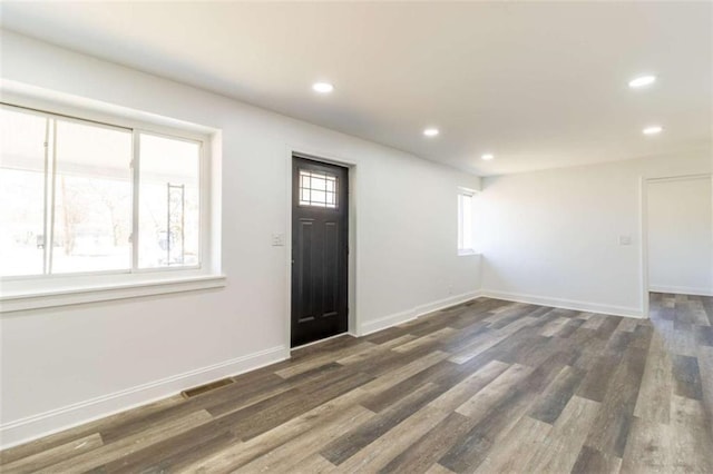 entrance foyer featuring recessed lighting, wood finished floors, visible vents, and baseboards