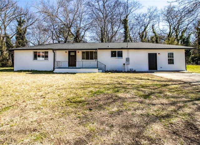 single story home featuring covered porch and a front yard