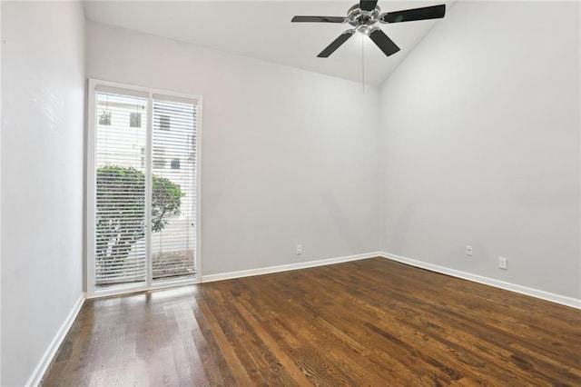 empty room featuring dark hardwood / wood-style floors, ceiling fan, and lofted ceiling