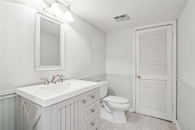 bathroom with vanity and toilet