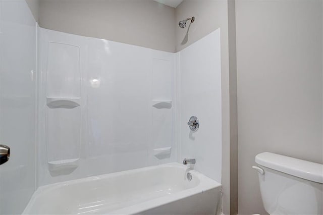 bathroom featuring toilet and shower / tub combination