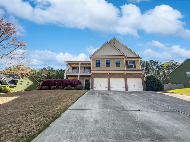 view of front of home with a garage and a front lawn